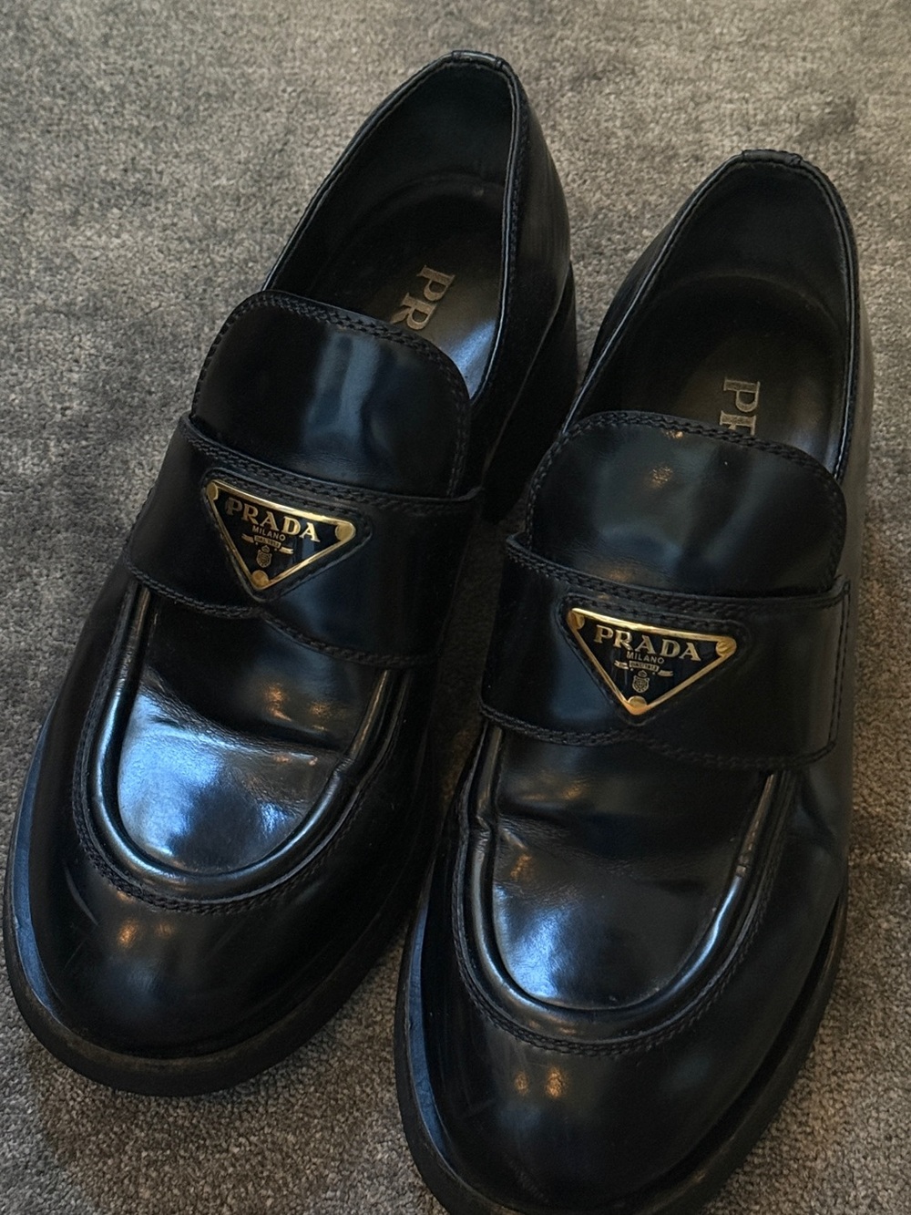 Prada Black Leather Women’s Slip-On Loafers with Gold Triangle Logo